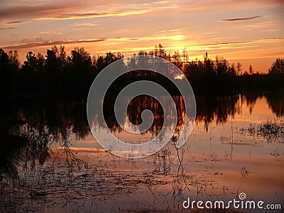 The landscape of the Northern nature. Forest. Sunset over the ri Stock Photo