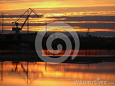 The landscape of the Northern nature. Sunset over the river Nadym. Construction on the Bank of the Nadym. Stock Photo