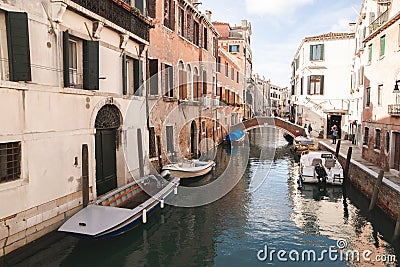 The landscape is not a tourist, atmospheric place in Italy. Boats, canal, bridge, small living island in Venice Editorial Stock Photo