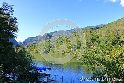 Landscape of Olt Valley with Olt river and Cozia Mountains in Romania Stock Photo