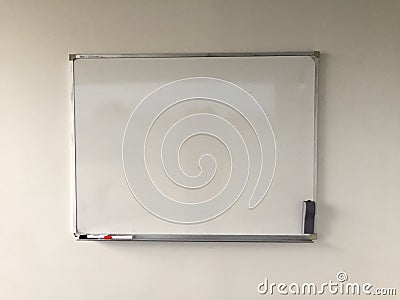 Whiteboard on white wall Stock Photo