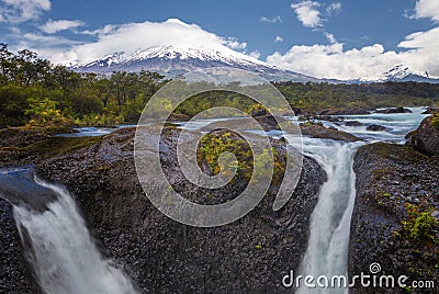 Landscape of the Osorno volcano with the Petrohue waterfalls and river in the foreground in the lake district near Puerto Varas Stock Photo