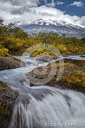 Landscape of the Osorno volcano with the Petrohue waterfalls and river in the foreground in the lake district near Puerto Varas Stock Photo