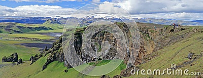 Landscape Panorama of Cliffs at Dyrholaey with Myrdalsjoekull Glacier, South Coast of Iceland Stock Photo