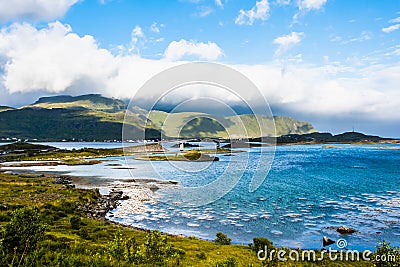 Landscape panoramic view to Fredvang bridge, Torvoya and buoya islands and Hovdanvika bay at Lofoten, Norway Stock Photo