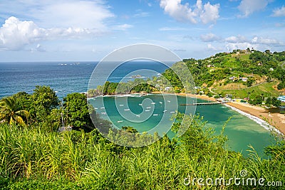 Landscape of the Parlatuvier bay surrounded by the sea under the sunlight in Trinidad and Tobago Stock Photo