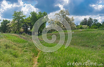 Landscape with pedestrian path to remote house in Ukrainian village Kamians`ke, Zaporizhzhia Oblast Stock Photo