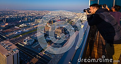 Landscape Photographers on rooftops in Dubai Stock Photo