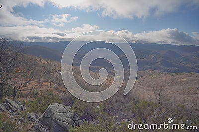 Barren hilly landscape in a sunny day Stock Photo