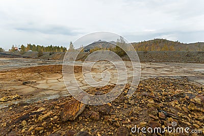 Landscape with red soil polluted copper mining factory in Karabash, Russia, Chelyabinsk region Stock Photo
