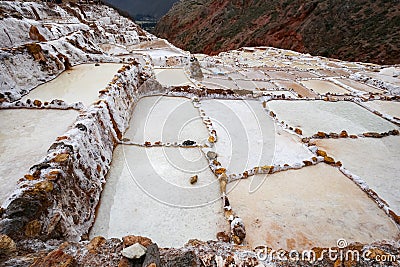 Landscape of the salt terraces of Maras Salineras de Maras in the Andes mountain range in the region of Cusco, Peru, Sacred Stock Photo