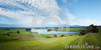 Landscape scenery with fleecy clouds Stock Photo