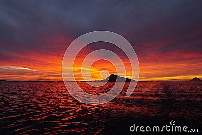 Landscape of the sea during a breathtaking stunning sunset in the evening Stock Photo