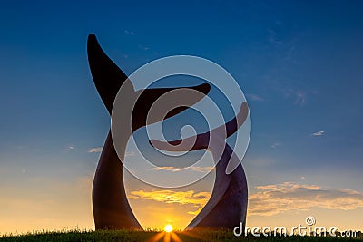 Landscape shot of the Reverence sculpture of two Whale Tails during a beautiful sunset in Vermont Editorial Stock Photo