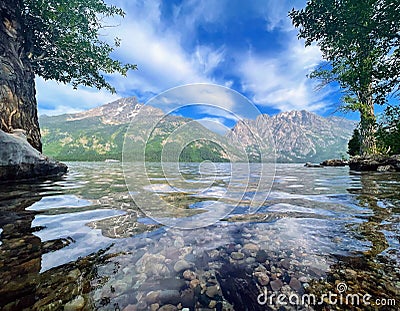 Landscape shot of the scenic Jenny Lake in Grand Teton National Park in the daylight Stock Photo