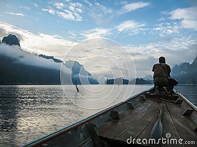 Landscape with silhouette of man at Chieou Laan lake, Thailand Stock Photo