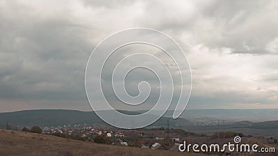 Stormy rain clouds over village, time lapse stock video footage Stormy rain clouds over village, time lapse stock video footage