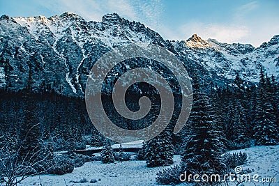 Landscape of snow-capped peaks of the rocky mountains in Sunny weather. The concept of nature and travel Stock Photo