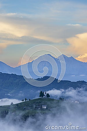 Landscape with St. Thomas Church (Cerkev Sveti Tomaz) near Skofja Loka, Slovenia Stock Photo