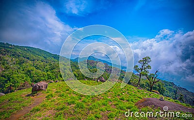 Landscape of sunrise on Green mountains and beautiful sky clouds under the blue sky, Dramatic moving cloud in nature landscape, Stock Photo