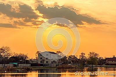 Landscape with sunset on the lake Stock Photo