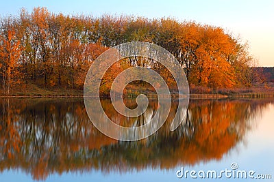 Landscape with trees reflecting in a lake Stock Photo