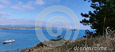 Landscape view of blue sea and sky with boat seen from songaksan mountain Stock Photo