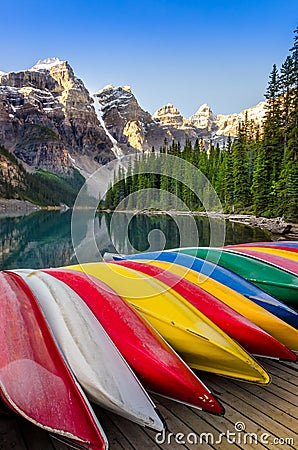 Landscape view of Moraine lake with colorful boats, Rocky Mountains Stock Photo