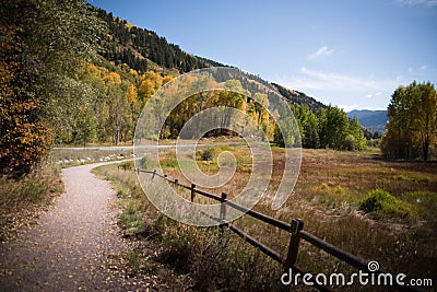 Landscape view of pathway with mountains and fall foliage near Aspen, Colorado. Stock Photo