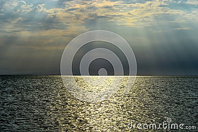 Landscape view of the setting sun over the sea Stock Photo