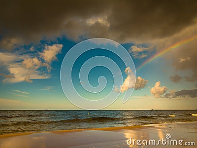 Landscape view on sky with rainbow at sea. Stock Photo