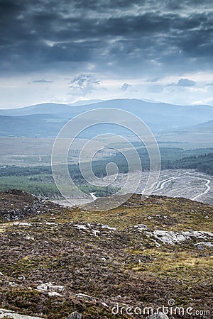 Landscape view from top of mountain on misty morning across countryside with fading layers Stock Photo