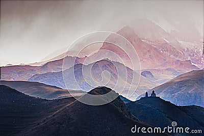 Landscape view of Tsminda Sameba church in Kazbegi during storm Stock Photo