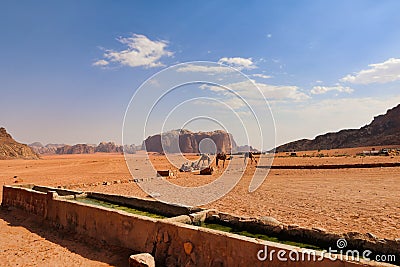 landscape view of wadi rum deser with group of camels Stock Photo