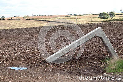Landscape views overa field of harvested crops,blocked gate way Stock Photo