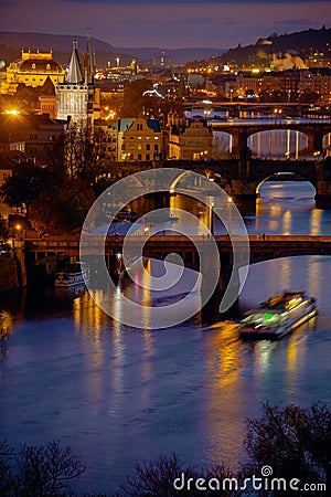 landscape with Vltava river, Karlov most and boat Stock Photo