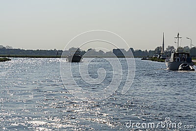 Landscape with waterways and canals of North Holland with boats, canal-side lifestyle in the Netherlands Stock Photo