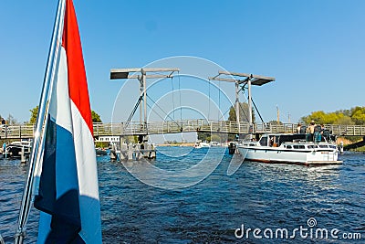 Landscape with waterways and canals of North Holland with boats, canal-side lifestyle in the Netherlands Stock Photo