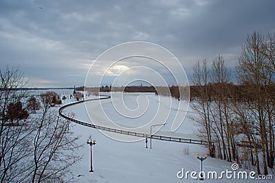 Landscape winter river, sky in the clouds, sunbeam Stock Photo