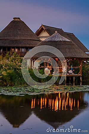 Landscape of wooden bower on the lake with water lilies in the evening Editorial Stock Photo