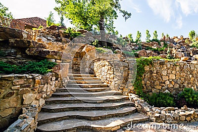 Landscaping. Decorative stone steps down the hill Stock Photo