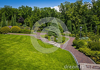 Landscaping in the garden. The path in the garden.Beautiful back Stock Photo