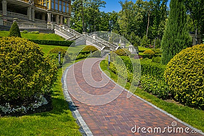 Landscaping in the garden. The path in the garden.Beautiful back Stock Photo