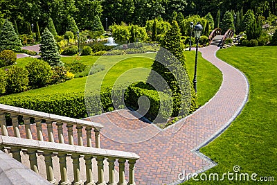 Landscaping in the garden. The path in the garden.Beautiful back Stock Photo