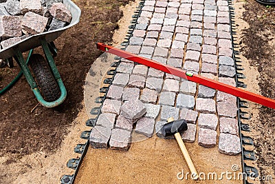 Landscaping and garden services - granite cobblestone walkway Stock Photo