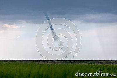 Landspout tornado over a farm field Stock Photo