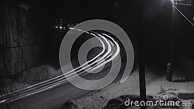 The lanes of light from the car headlights on the freeway. Night. Long exposure. Selective focus. Stock Photo