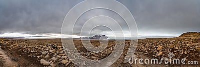 Langjokull Glacier behind huge muddy and rocky wasteland in the heart of iceland Stock Photo