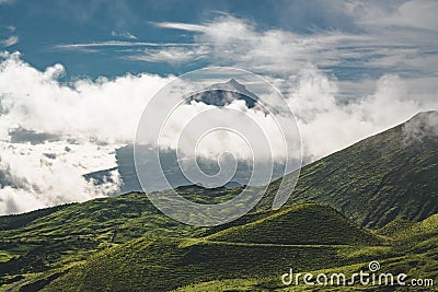 Lanscape near EN3 longitudinal road northeast of Mount Pico and the silhouette of the Mount Pico along , Pico island Stock Photo