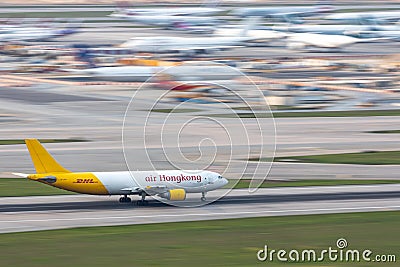 Air Hong Kong`s cargo airplane is running for take off at runway, all parking space is Editorial Stock Photo